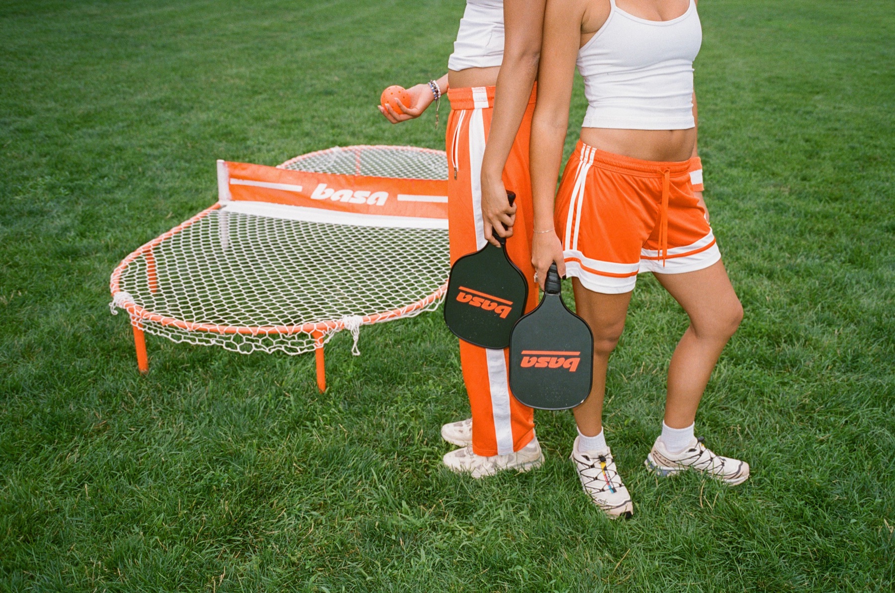 Players holding basa paddles